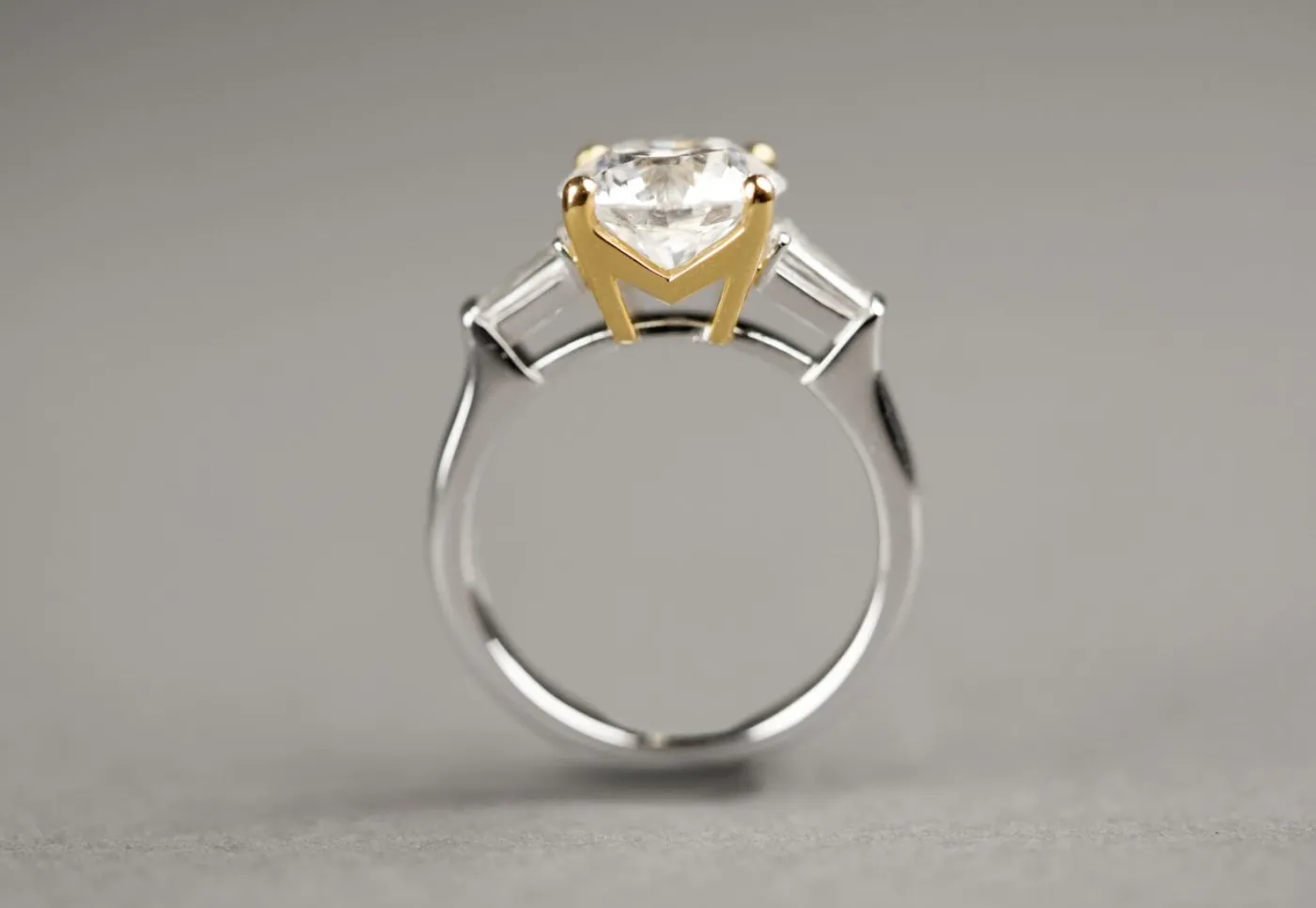 Platinum mix yellow gold ring with 3 carat Diamond and baguette at side — view 1